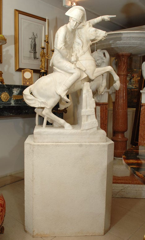 19th Century Empire marble sculpture of Napoleon on horsebsck riding through the alps. Sitting on a limestone base