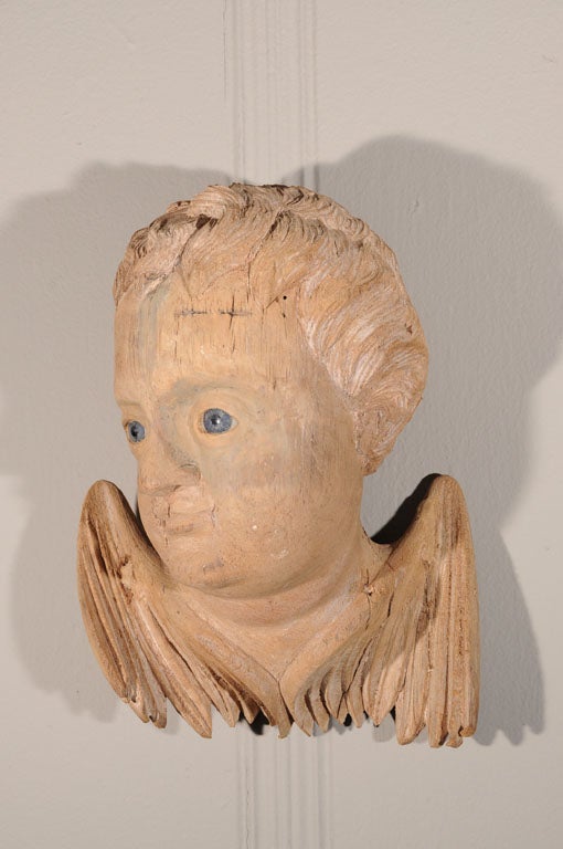 Wooden image of a putti or baby angel Made to hang on the wall