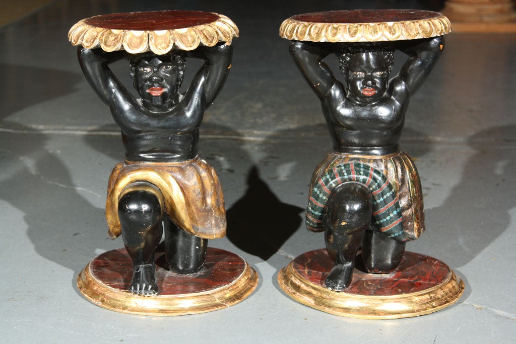 A pair of late 19th century Blackamoor tables.