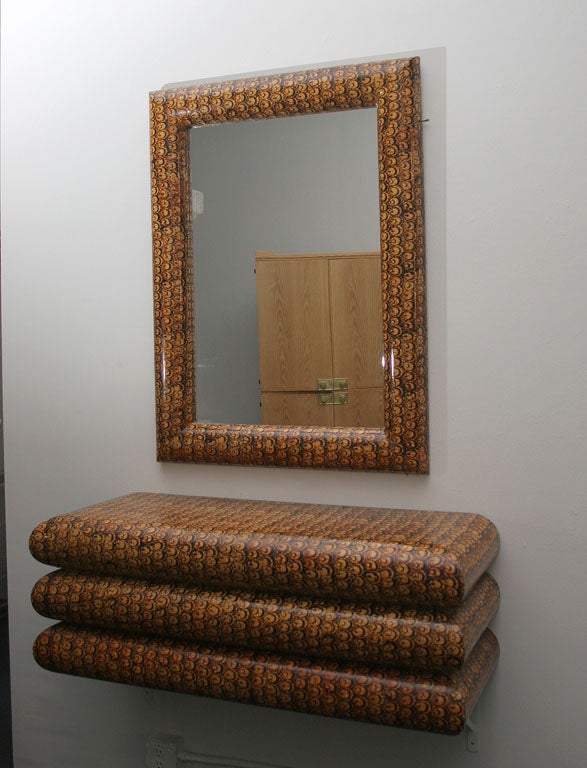 Stunning 1970's wall console & mirror by Karl Springer. Solid hardwood covered in handmade batik fabric with clear lacquer finish. Console dimensions: 46 L x 17 H x 17.5 D, Mirror dimensions: 44 H x 33 W.  Mint condition.