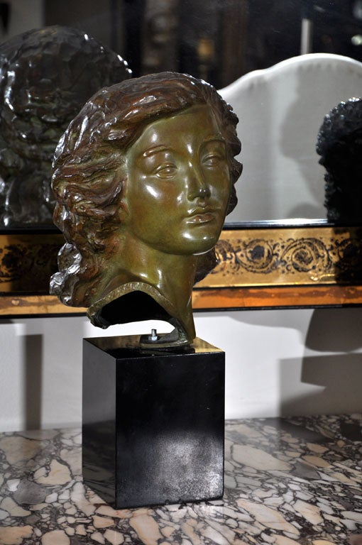 A patina bronze bust of a woman by Hungarian sculpture Alexander Kelety. 
  