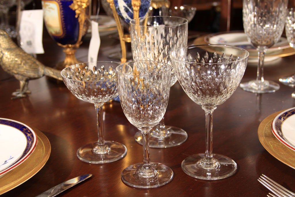 Baccarat 'Magenta' pattern stemware for 8. Consists of red wine, white wine, champagne, and water.
