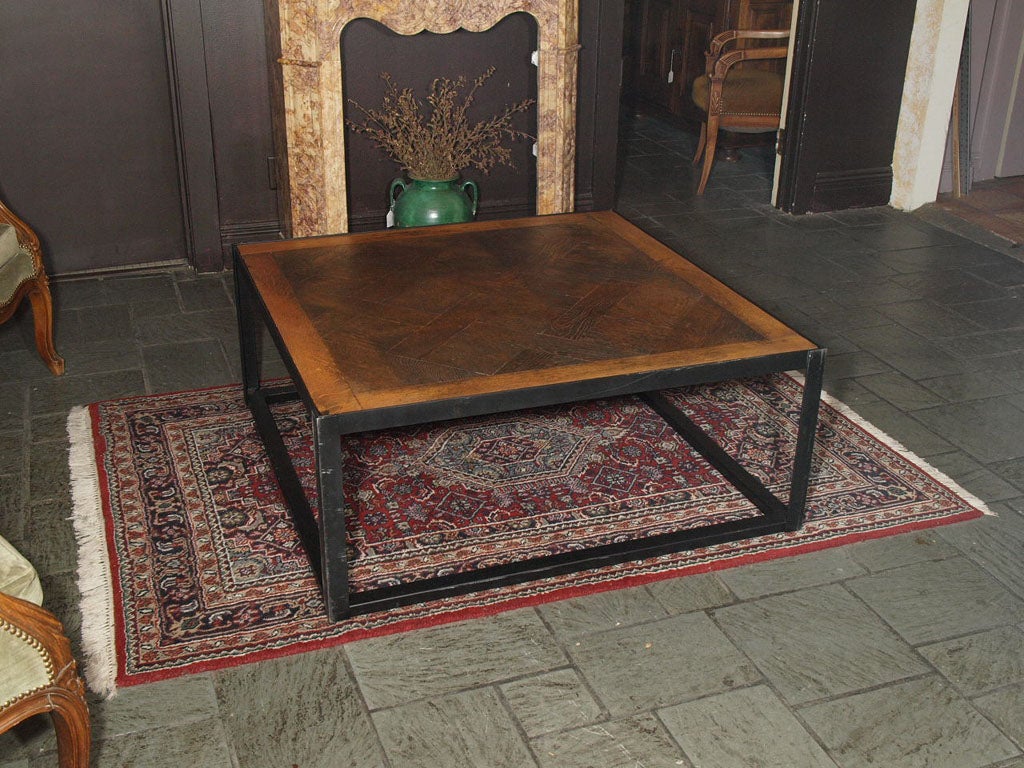 Antique French parquet table on iron base.