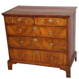 William and Mary walnut chest of drawers. Crossbanded top.