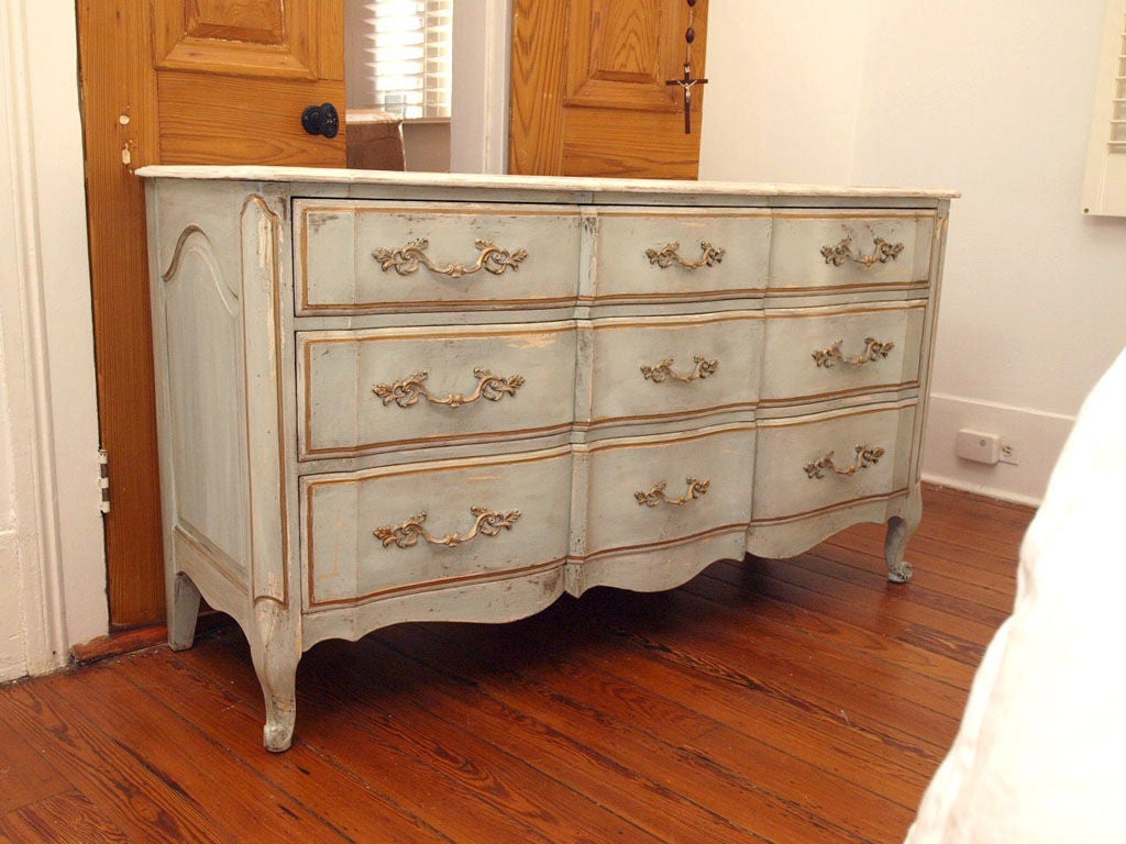 Beautiful French Provincial nine (9) drawer dresser with original french blue paint on body, white top, and gilt details throughout.  Gorgeous original harware and cabriole lets.  A beautiful classic piece.