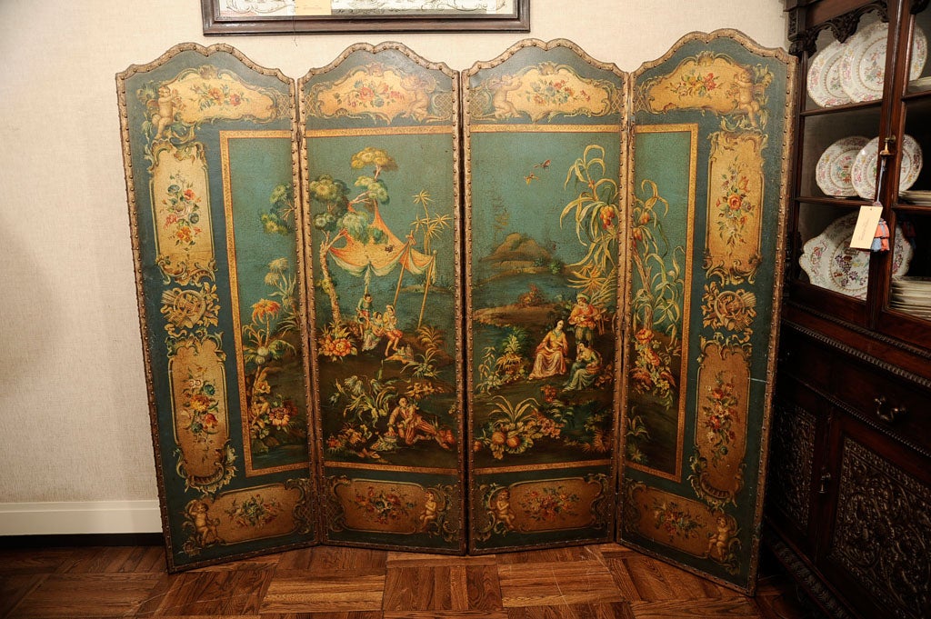 Fine English Regency Four-Panel Painted Leather Screen Ornamented on a Blue and Green Ground with Gold Borders of Floral and Putti Design Surrounding a Figural Landscape. England, c. 1825<br />
<br />
Each panel: 22 inches wide x 72 inches high