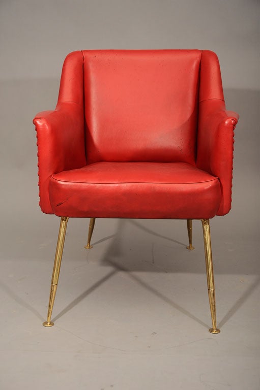 A rare and important arm chair by Carlo Pagano. Original sky upholstered seat on brass stand.