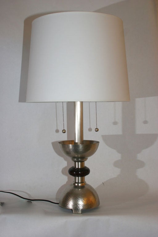 A pair of modernist table lamps silver plated and wood 
New sockets and rewired
Shades not included