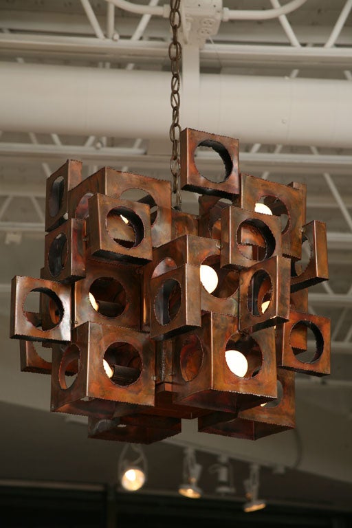 This 60's Pop-infused, copper chandelier gives a witty nod to Bertoia, Evans, and Fantoni.
