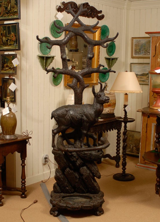 An exceptional 19th c. hand-carved Black Forest Mountain Goat Hall Tree with mirror.