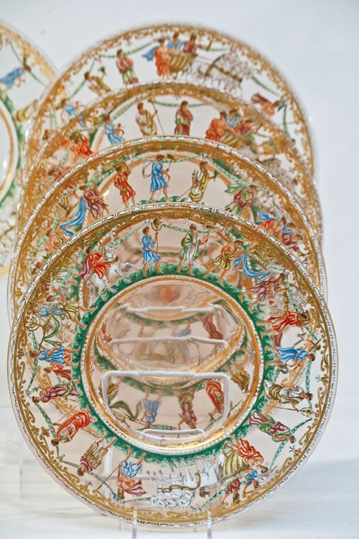 Extraordinary set of 12 hand blown Venetian chargers with hand painted enamel Classical subjects encircling the borders. These amazing chargers are blown in a subtle and soft pink and the painting is detailed and beautifully executed. The chariots