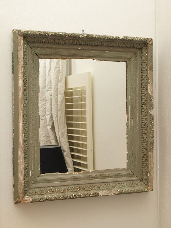 This antique French hand-carved mirror was originally a frame converted into mirror with its original sage green paint. Perfect for a decor mixing aged pieces with modern furniture.