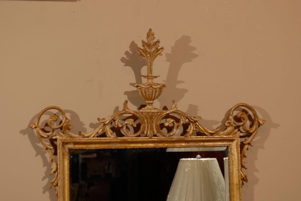 20th Century Sheraton Style Gilt Mirror with Scroll and Urn Pediment For Sale