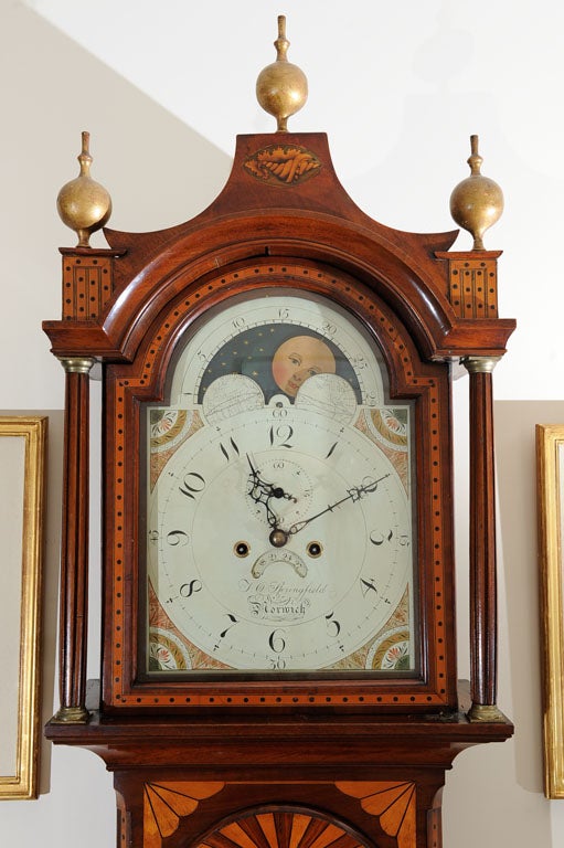 Beautifully detailed inlaid Tall Case Clock by Thomas Osborn Springfield (1782-1858) of Norwich England.  Mahogany, with various inlays. Stepped pediment with inverted arched sides decorated with shell paterae and surmounted by 3 gilt-wood orb