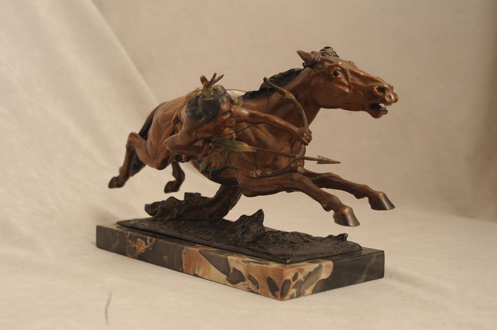 Beautifully detailed, colorful, action packed cold painted Vienna bronze of an American Indian on a horse in full gallop.  This highly collectible bronze bears the Bergmann signature and is one of the more exotic examples of this genre.  Franz