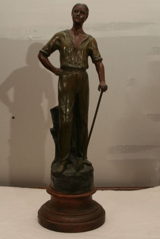 Sculpture of spelter, ploished and polychromed and affixed to a turned wood base