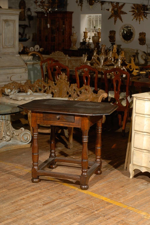 An exquisite 18th century Swedish period Baroque side / accent natural wood table with antique newer top, single drawer and turned legs.  This Swedish  table also features side stretchers and stands on bun feet, circa 1690-1730.