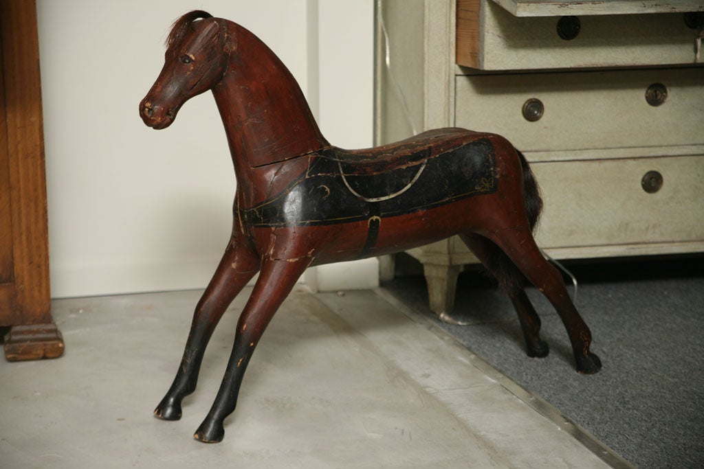 A painted wooden toy horse.