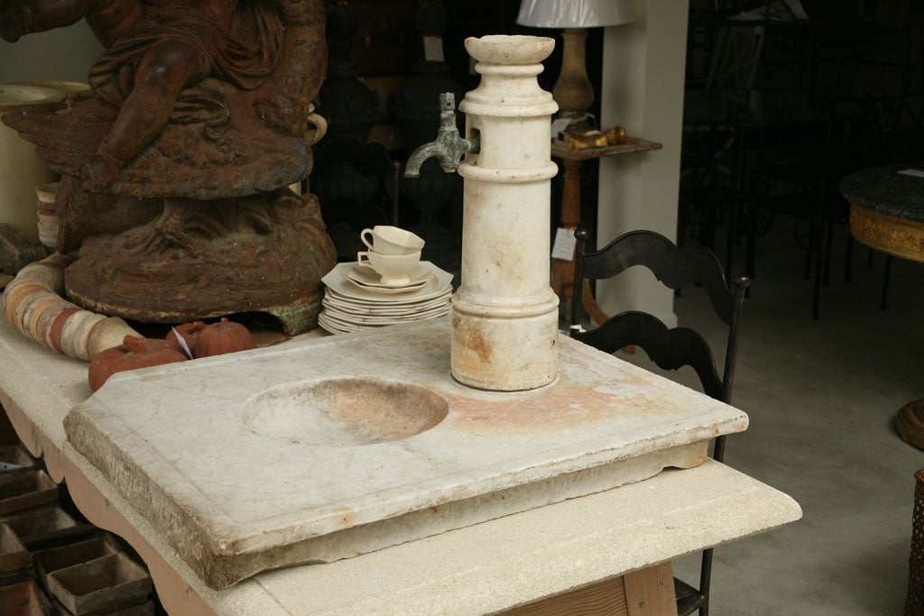 A Directoire white marble washing basin with beautiful Patina. Very rare!.