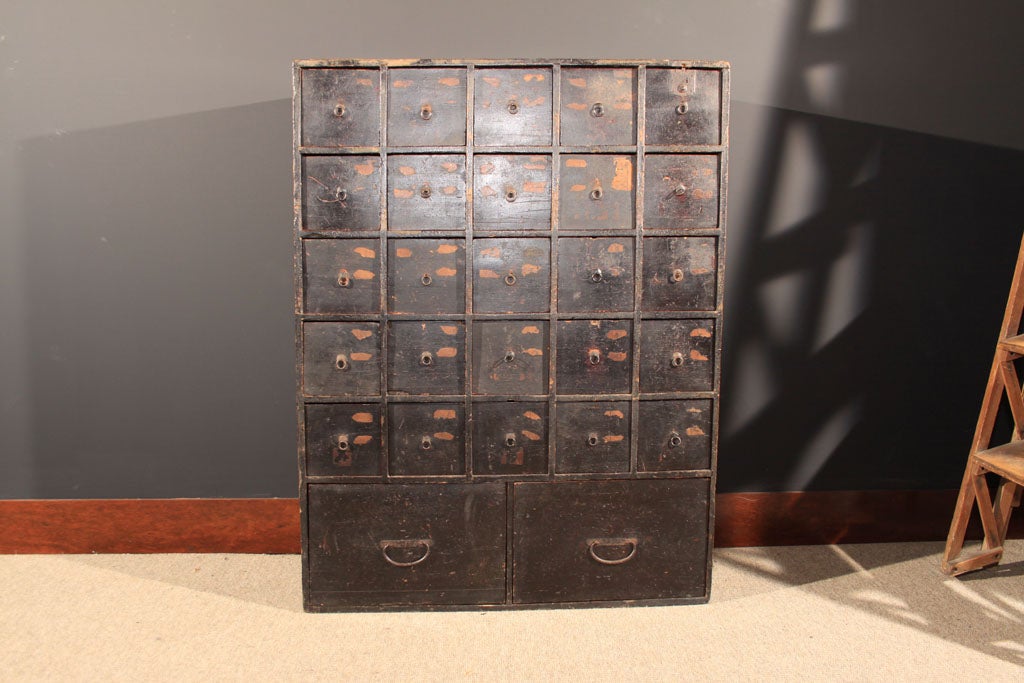 Japanese apothecary chest (kusuri dansu) with unusually large square drawers. The chest consisting of a series of square drawers for the storage of medicinal ingredients.  <br />
Late Edo Period (1600-1868), 19th century