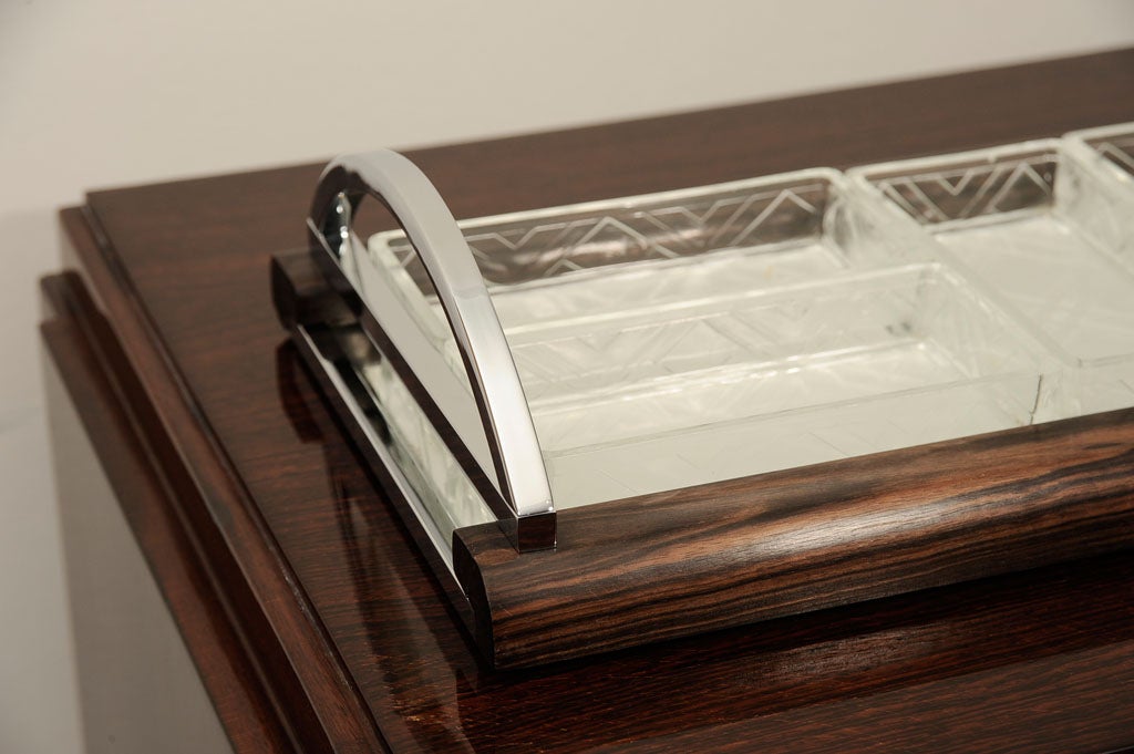 French Art Deco serving tray in macassar ebony, nickel plated trim, a mirrored bottom and five rectangular beveled crystal inserts.