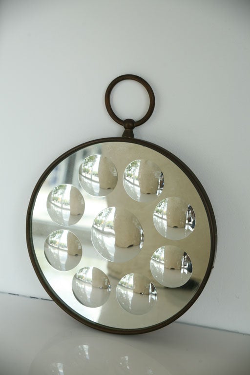 Fornasetti Optical Mirror<br />
Brass and Mirror<br />
Fornasetti label on the back