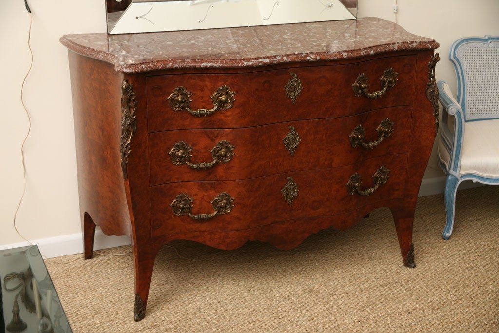 Late 19th century Italian Bombe dresser. Verona red marble-top.
Louis XV style. With bronze mounts.