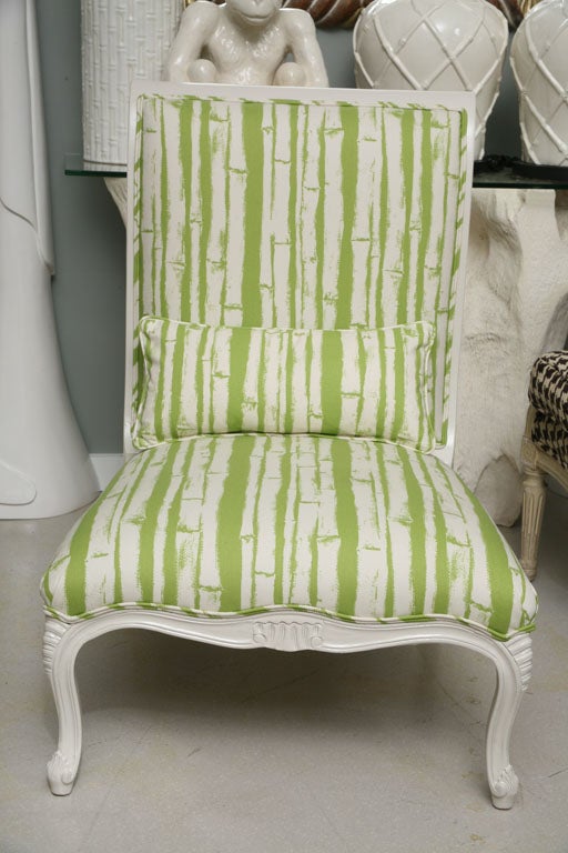 Pair of white lacquer slipper chairs with green and white bamboo fabric. Pretty from all angles.