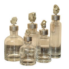Unique Set of Five Bottles with Stone Fragment Lids