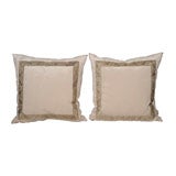 A PAIR OF PILLOWS WITH ANTIQUE TRIM