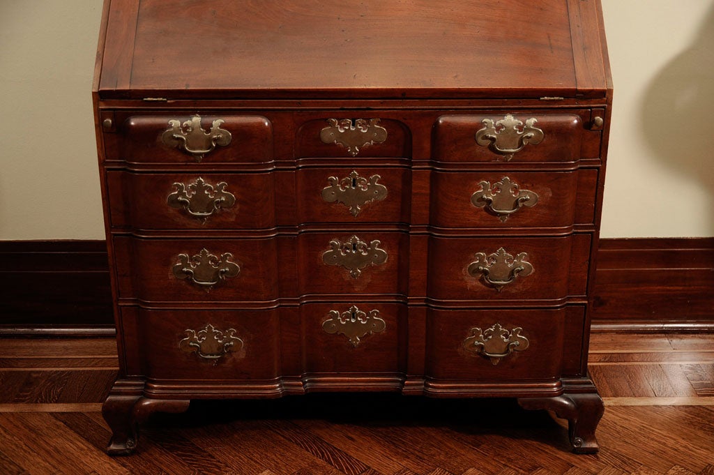 AN IMPORTANT AND RARE DIMINUTIVE CHIPPENDALE SHELL-CARVED AND FIGURED MAHOGANY AND CEDARWOOD BLOCK-FRONT DESK AND BOOKCASE<br />
<br />
The blockfront desk-and-bookcase is one of the most highly regarded and sought after forms of Colonial American