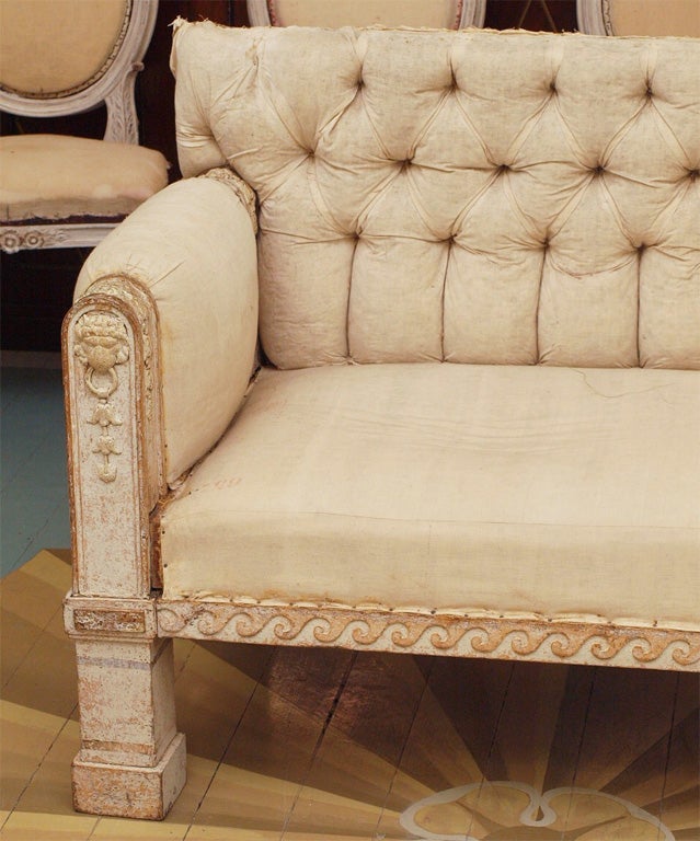 Painted sofa with tufted back and rolled arms, in the Turkish taste.