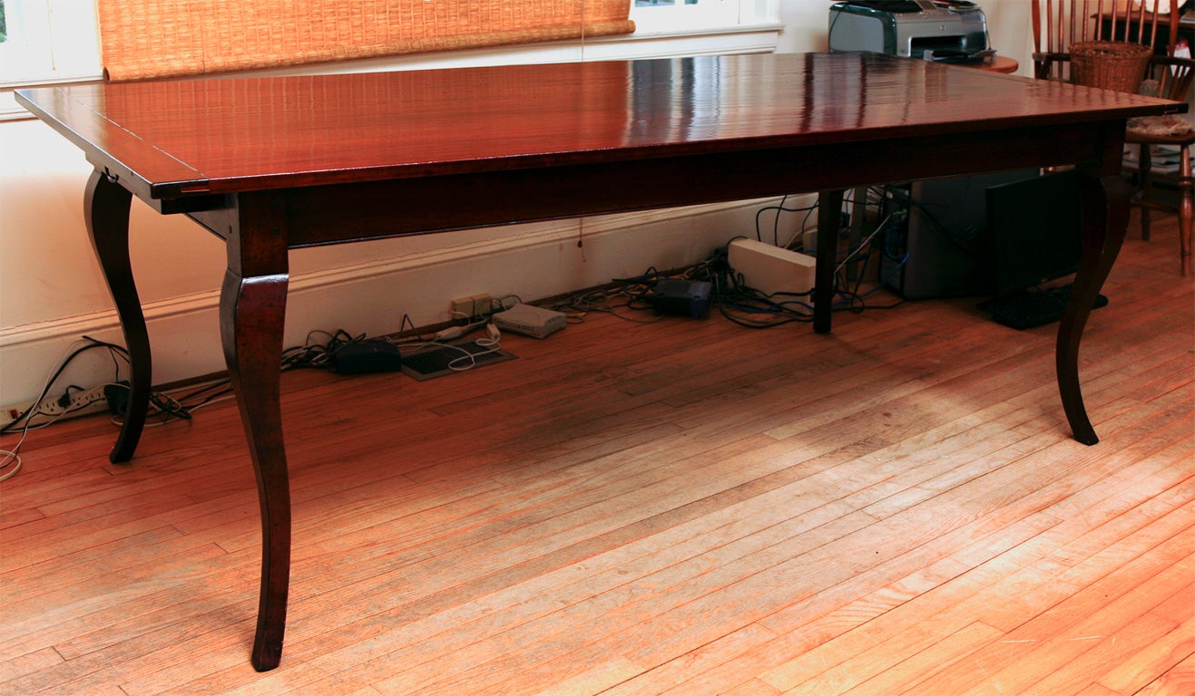 This wonderful reproduction cherry dining table was made in England by a master craftsman. It measures 7ft long and 40