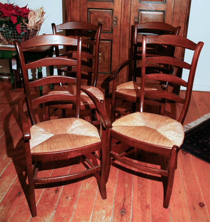 These French reproduction chairs are made from a very fine dealer in France, in beech wood. They are made in an American size and have wonderful lines and a dark , rich patina. i only have four left, 2 arm and 2 side chairs. the Side chairs are $575