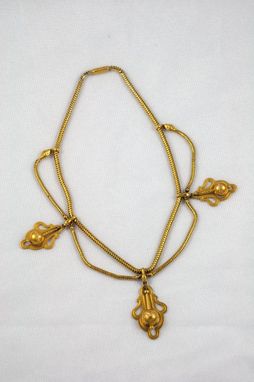 PETITE EGYPTIAN REVIVAL SNAKE NECKLACE WITH DROPS AND LOCKET BACK, ENGLISH, 18CT. GOLD