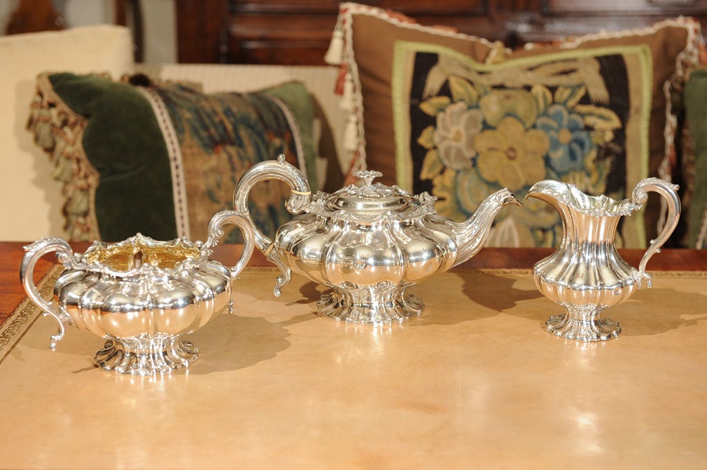 Each of lobed form with foliate cast rim decorated with boutiful bell flowers and leaves, includes lidded tea pot, open sugar bowl and cream pitcher.  London with makers marks probably those of John & Joseph Angel.