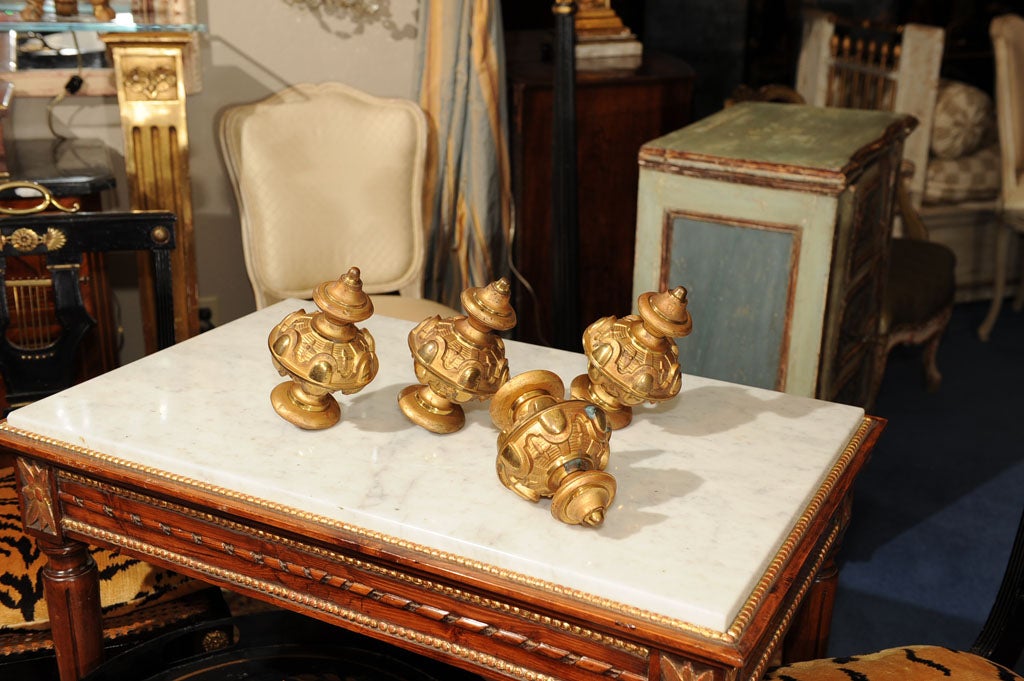 Each globe-form finial with elegant cast architectural features.  Screw bottom