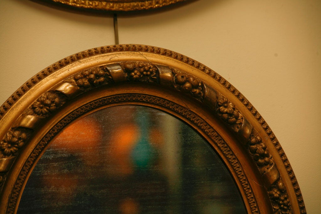 Italian Oval gilt wood mirror For Sale