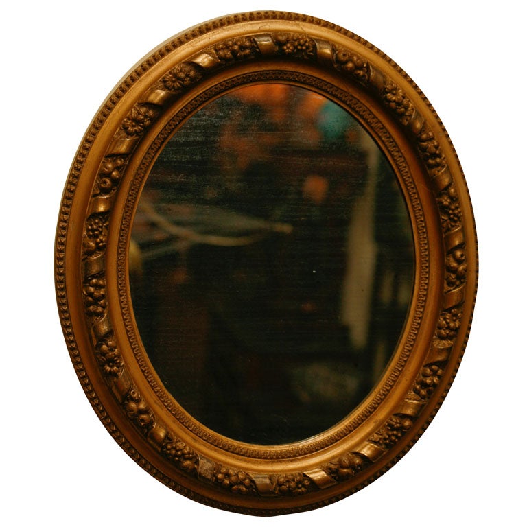 Oval gilt wood mirror For Sale