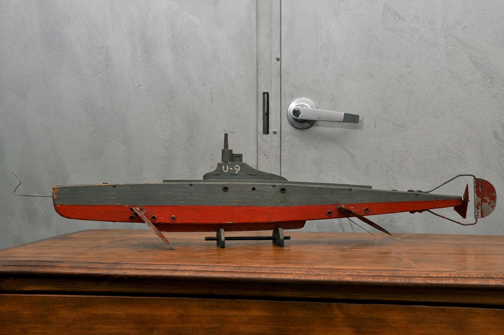 This is an American, home made and one of replica of a U-9 submarine, circa 1920's. Once the joy of a sea faring enthusiasts it has character and is marked with the knocks of time. Jefferson West Antiques offer a selection of unusual decorative
