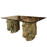 Pair of composition horse head form table bases with glass top