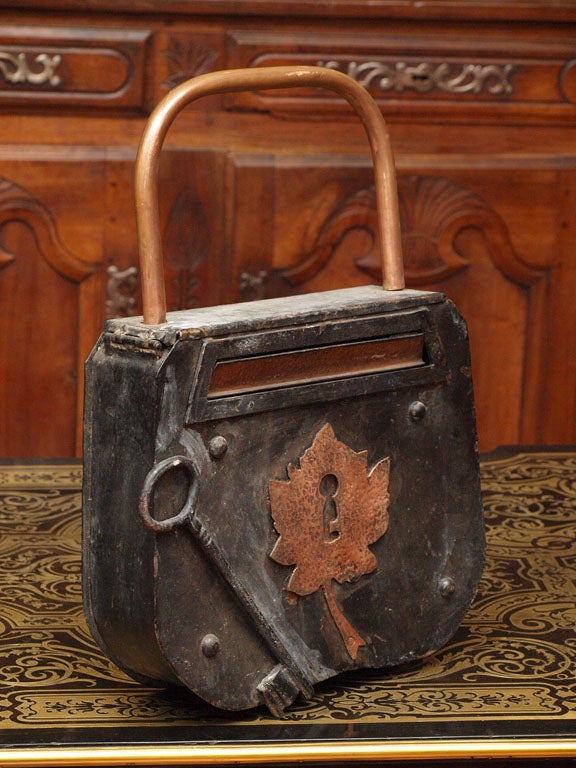 one of a kind iron,tin, and copper mailbox with a key and maple leaf motif.
