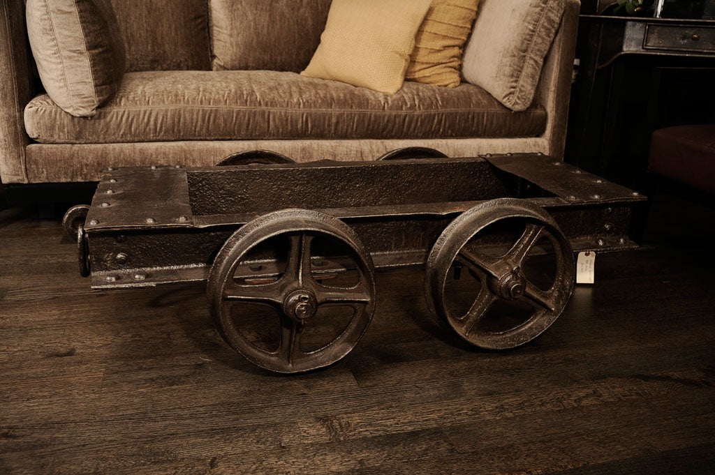 Industrial Cocktail table, railroad cart with fixed wheels and glass top