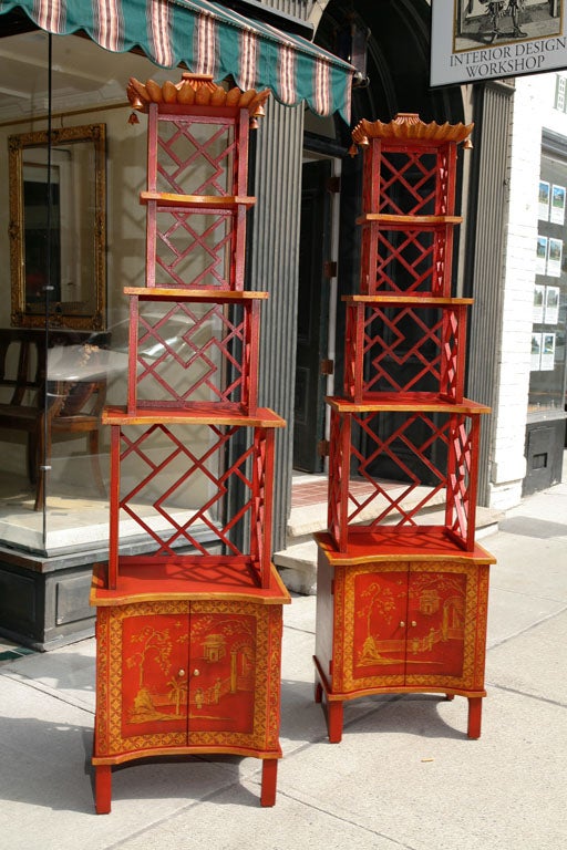 This vintage pair of Chinoisere etageres are conceived as a left and a right which can clearly be seen in the photos. Note the fret work at the backs of each cabinet. Done with a number of Chinese inspired details including landscapes, people and