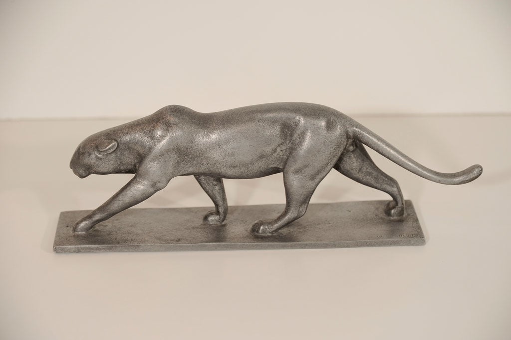 This special panther is highly stylized and Signed and dated. It would be great on a mans desk.