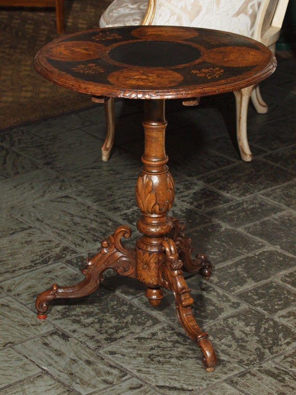 Antique Swiss inlaid walnut round table.