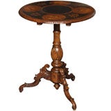 Antique Swiss inlaid walnut round table.