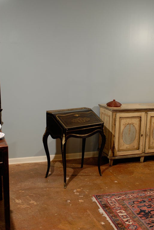 Louis XV ebonized ladies bureau with brass inlay and original brass gallery. Original felt writing surface, could be replaced with leather if desired at additional cost.