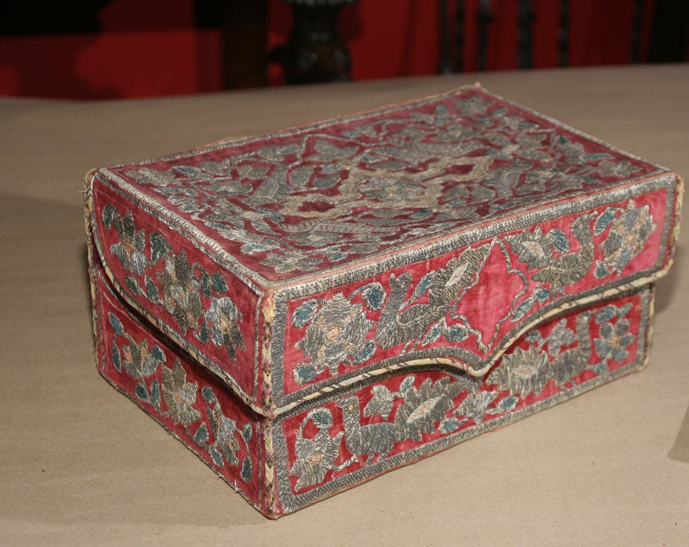 18th Century Italian silver and other metallic thread embroidered velvet box, the top with arabesque design worked with birds, flowers and vines, the front similarly worked, the sides with floral embroidery, the interior with printed floral fabric.