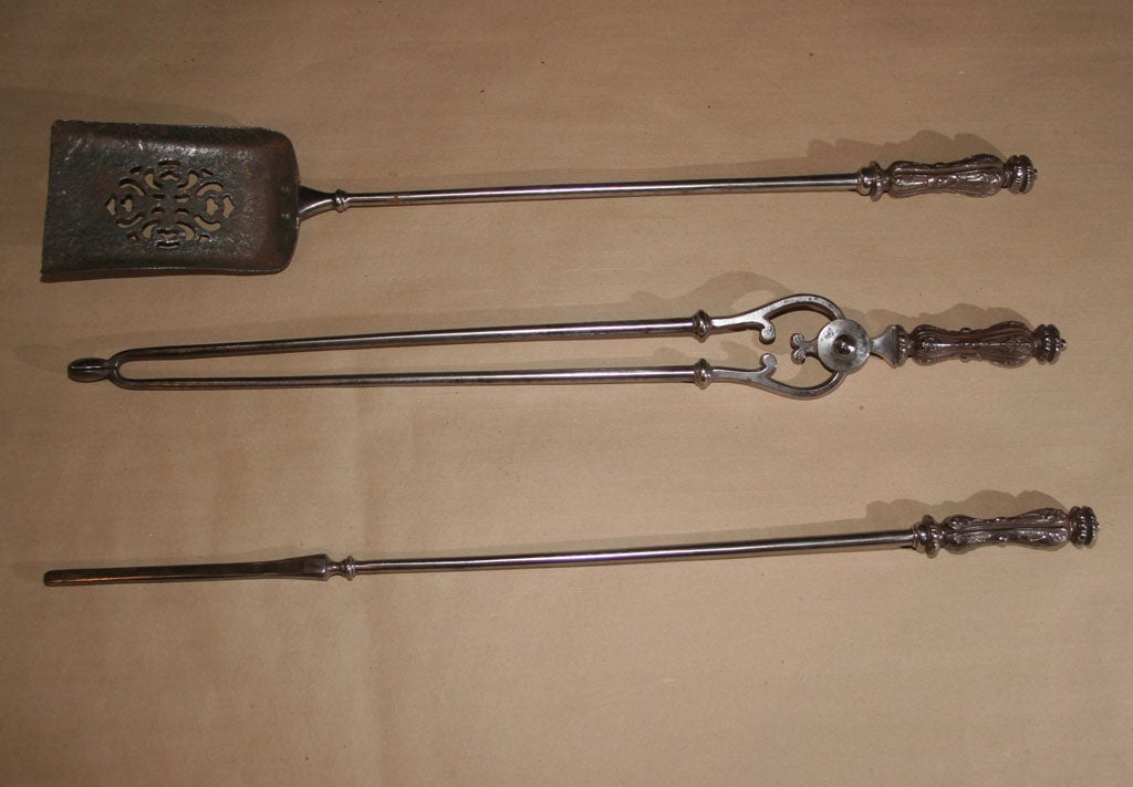 Fine set of English Steel and cast steel fire tools, the cast handles with lobed ringed finials over acanthus leaf handle, the shovel with pierced fretted decoration